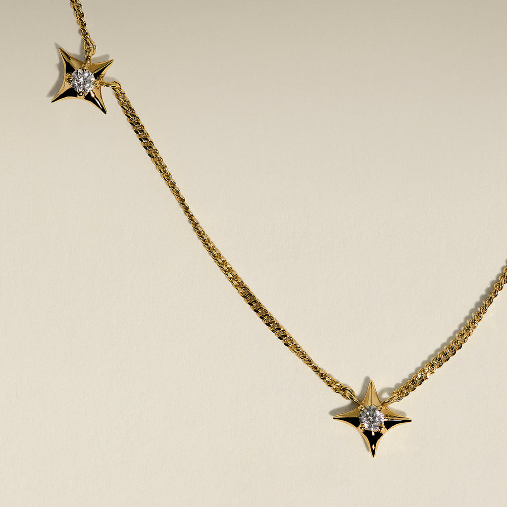 Cosmic Star Charm Necklace in Gold