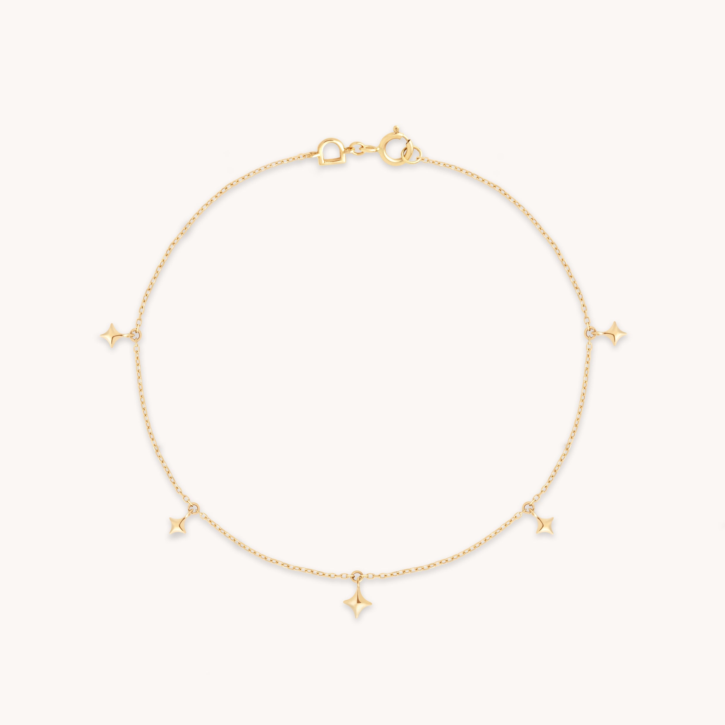 Cosmic Star Charm Bracelet in Solid Gold