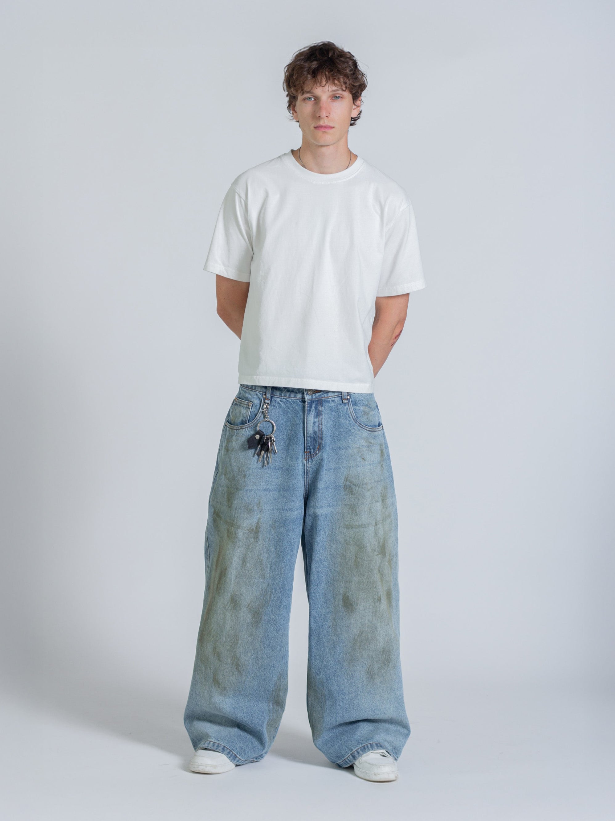 MUD STAINED JEANS - LIGHT BLUE
