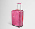 The Bigger Carry-On in Translucent Pink