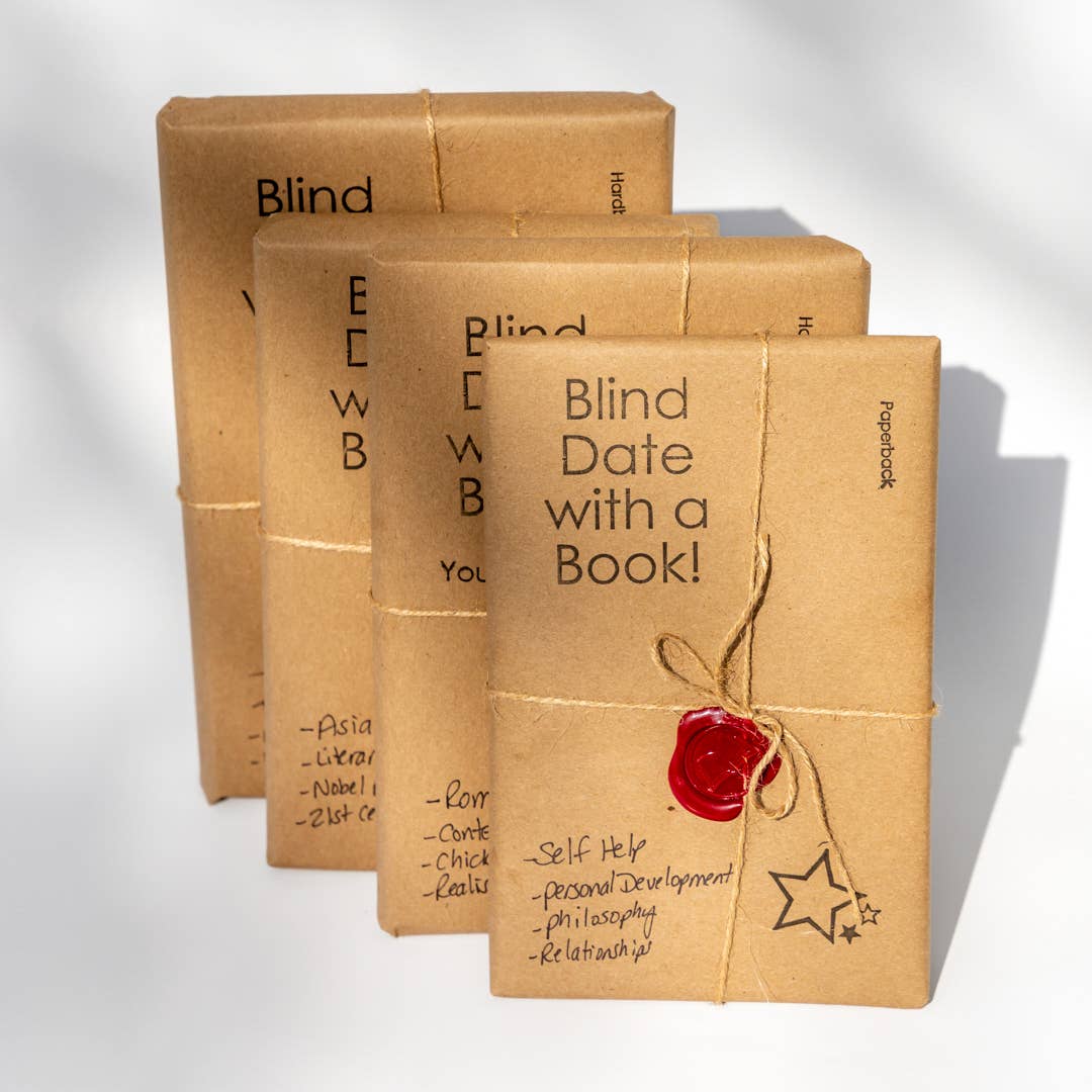 Wrapped surprise books in brown paper tied with string and a red wax seal.