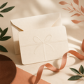 Digital Present Agent gift card with cream envelope and terracotta ribbon