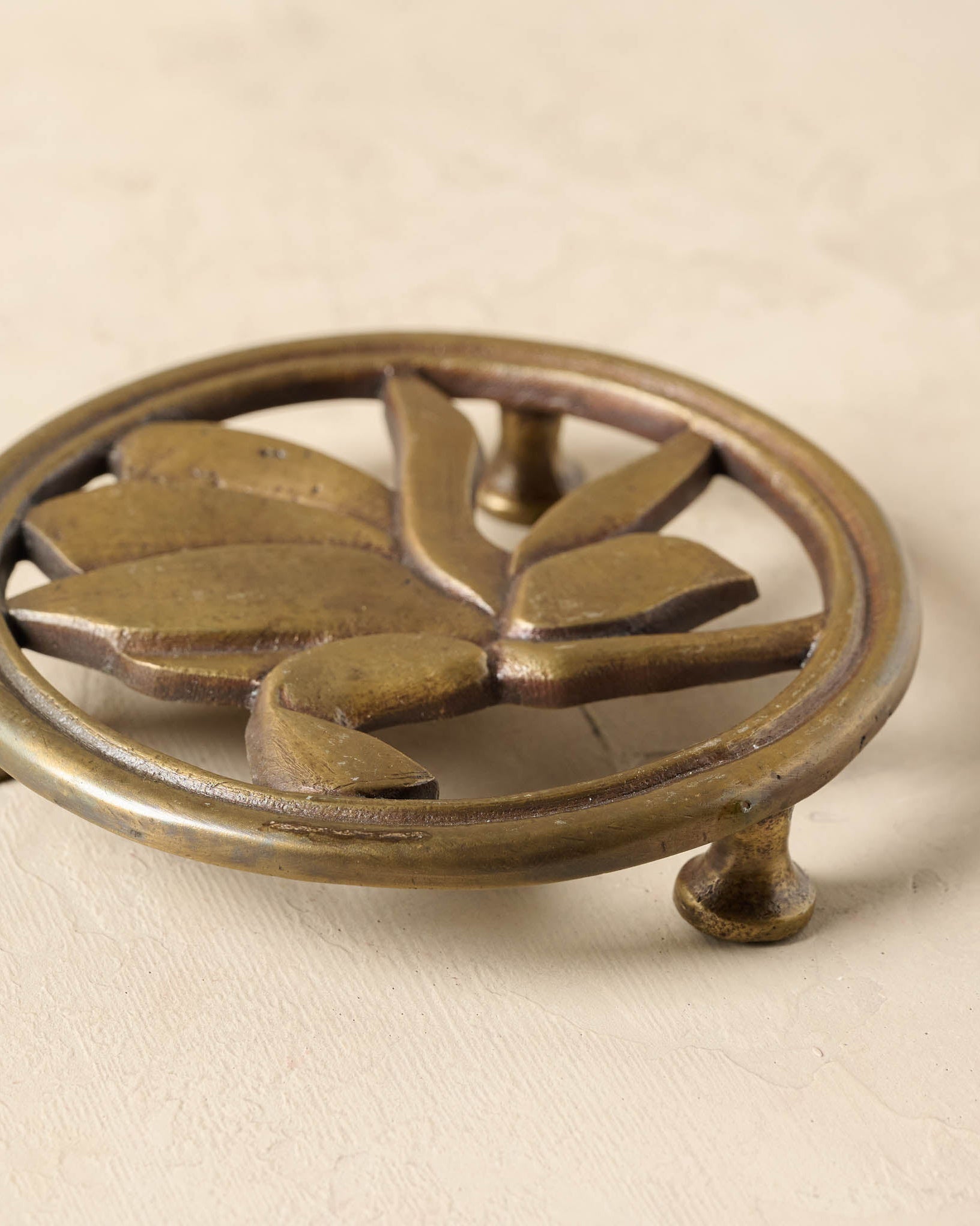 Magnolia Antique Brass Trivet